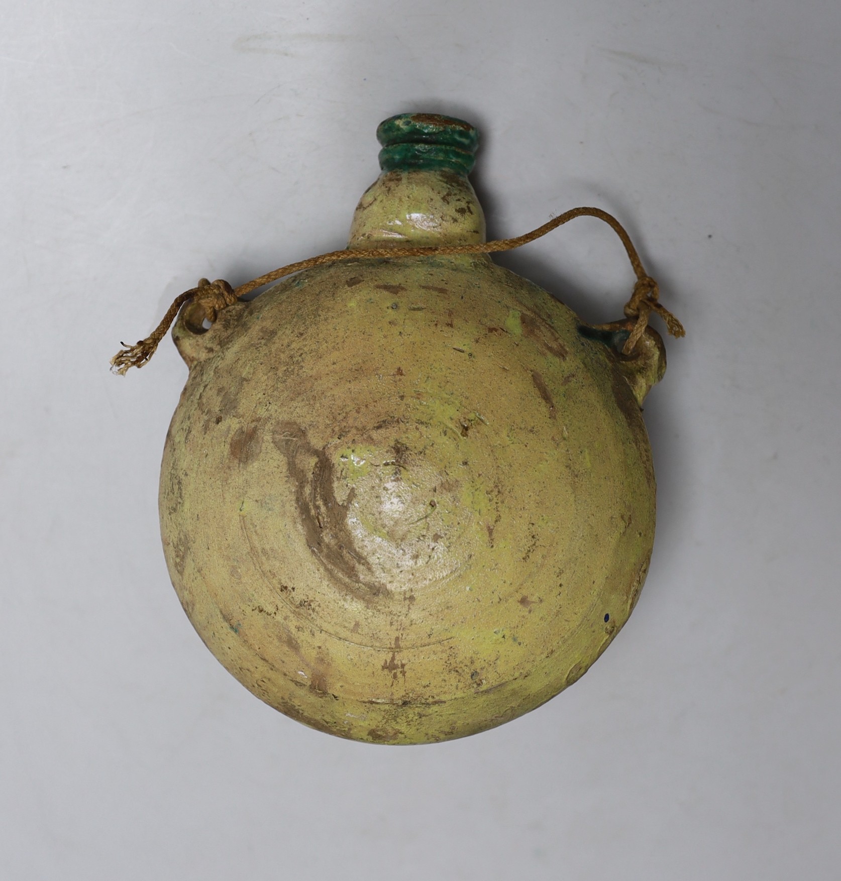 A late 19th century Moroccan pottery flask, 19cms high